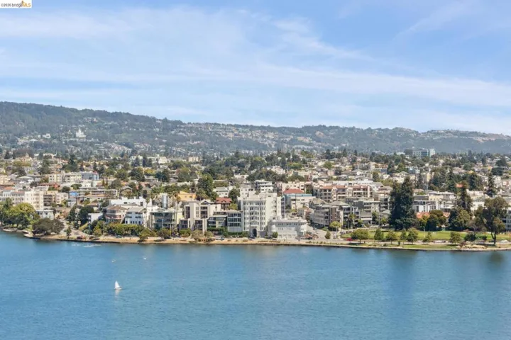 Water view featuring mountains and nearby urban area