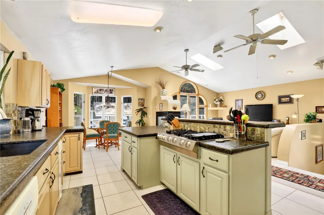 The kitchen, dining, and living areas seamlessly flow together