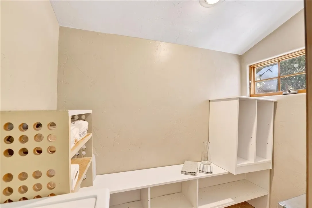 Tons of storage throughout the home: walk-in pantry, 2 garages, and the workshop