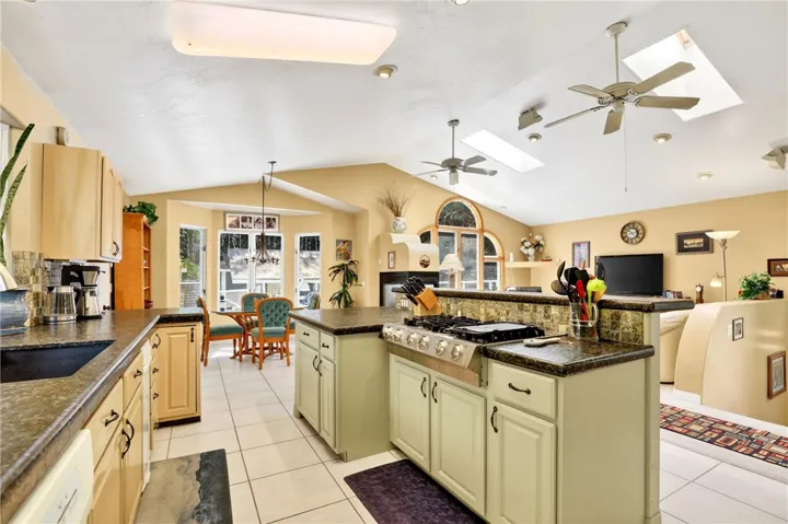 The kitchen, dining, and living areas seamlessly flow together
