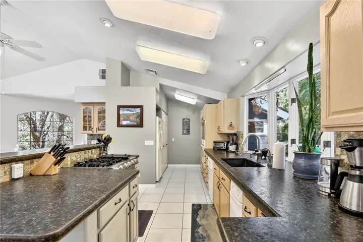 The chef's kitchen features ample counter space and storage.