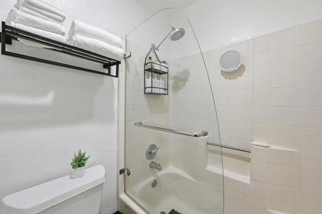 Shower over Tub in ensuite bathroom.