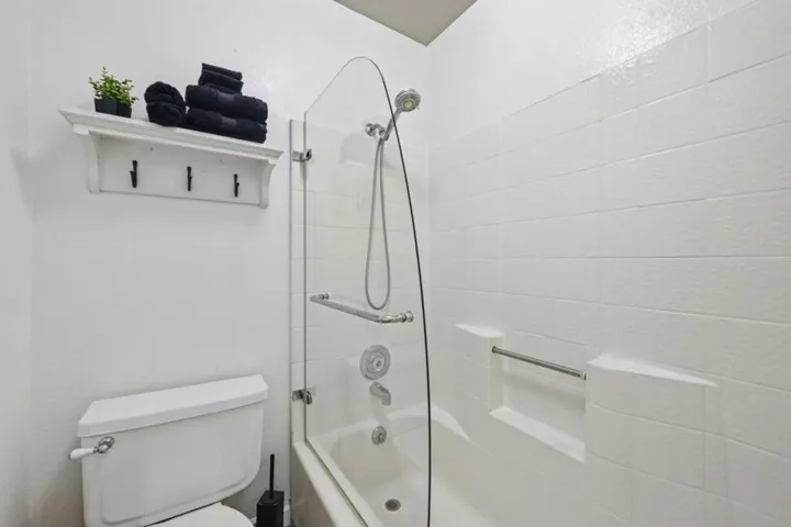 Shower over tub in top floor Bathroom.