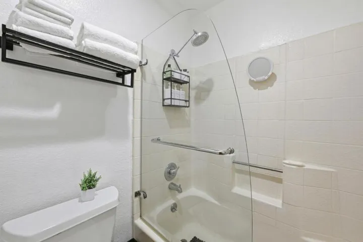 Shower over Tub in ensuite bathroom.