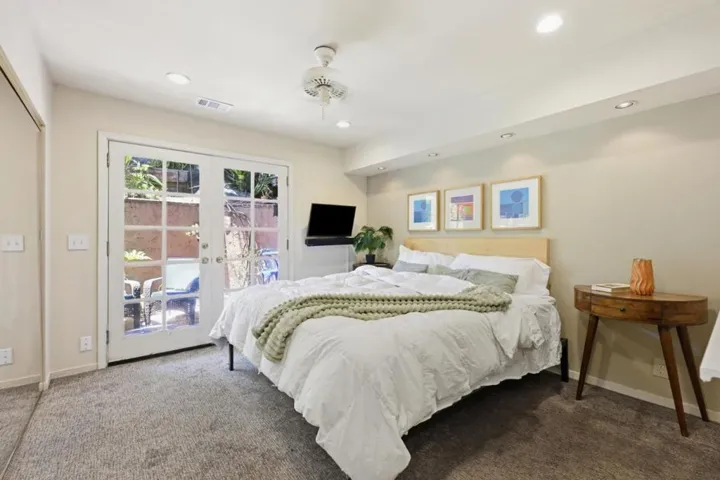 Main Bedroom (3) on bottom level with French doors to private patio.