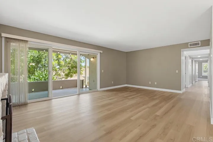 Living Room and Patio - Original Photo (see virtually staged photo too)