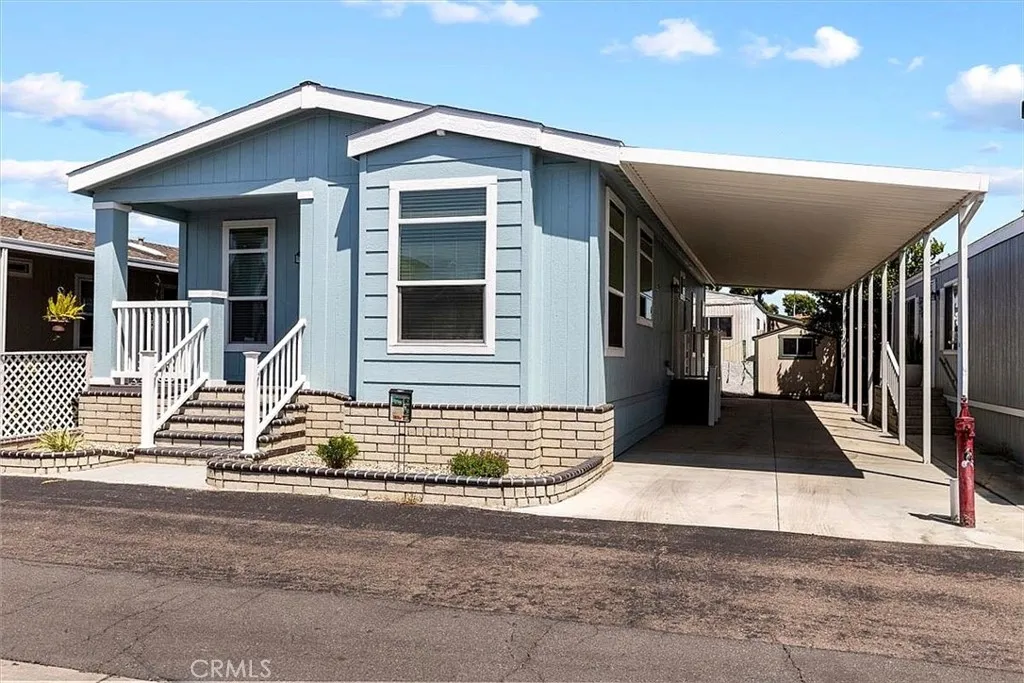 Front of home: 9080 Bloomfield spc 231, Cypress. Origional front
