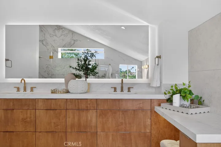 Lighted mirror and custom cabinetry