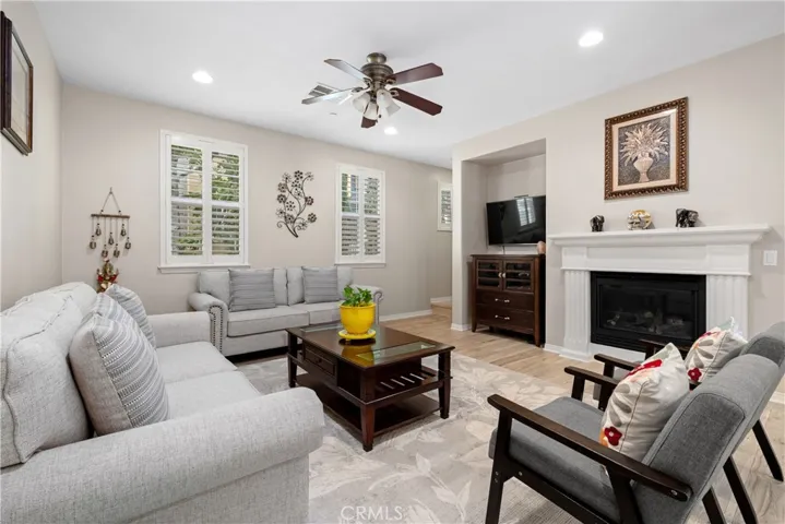 Living room with an entertainment niche, Plantation Shutters that completes the Living room area.