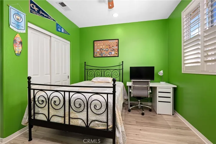 Another view of the Secondary Bedroom with closet space.