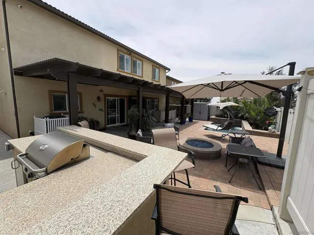 Enjoy your new entertainment and family fun amenities!  BBQ island, fire pit, pool, outdoor TV and views!!