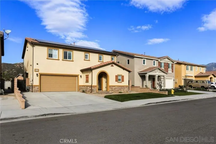 Atractive exterior front has artificial turf for low maintenance. Driveway parking and additional street parking.