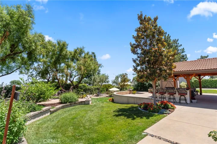 Manicured Yard with Mature Trees for Shade and Privacy