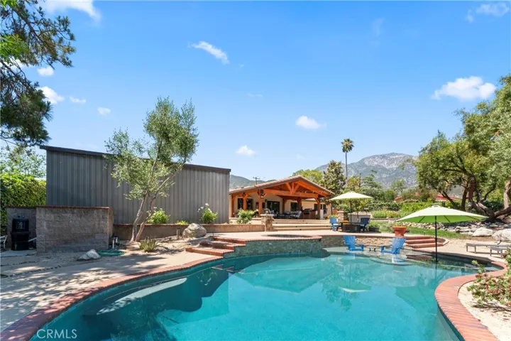 Pebble Tech Pool with Mountain Views and Large Storage Shed