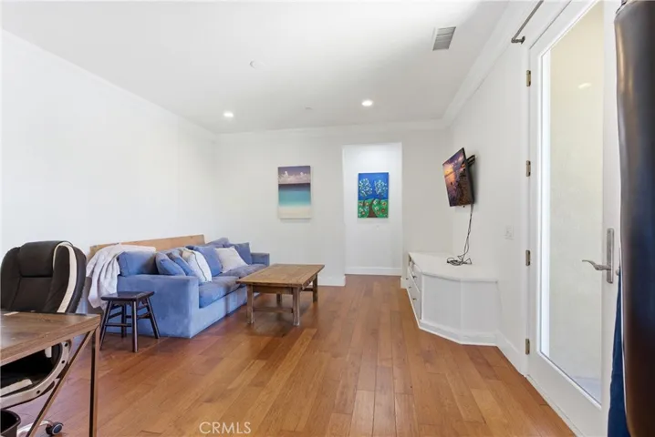 Expansive upstairs bonus room ideal for a media lounge, game room, home office, or additional living space.