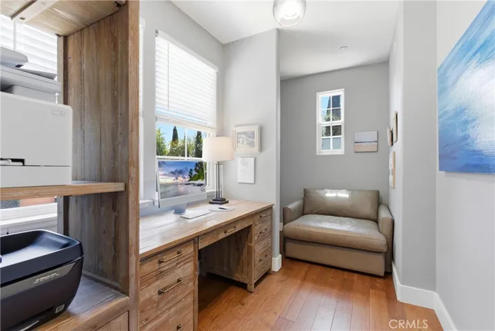 Dedicated office nook with custom built-ins and natural light, ideal for working from home or creative space.