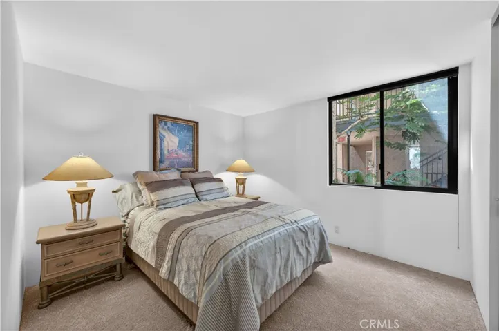 Guest bedroom overlooks the lush central space.