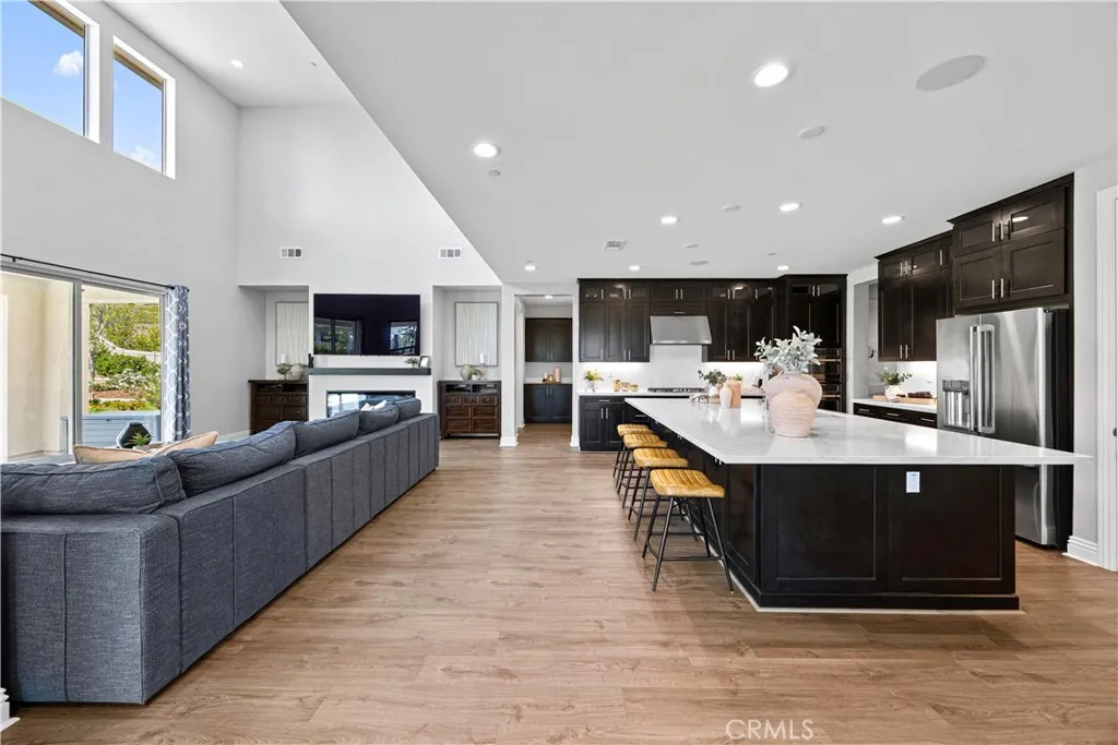 Floor to ceiling light fills the spaces. All blinds are motorized.