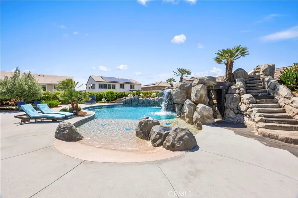 Custom rockscape including beach entry and "volcano" bubblers