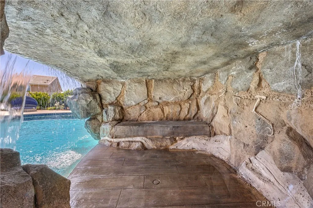  Grotto beneath the waterfall is lighted and wired for TV.