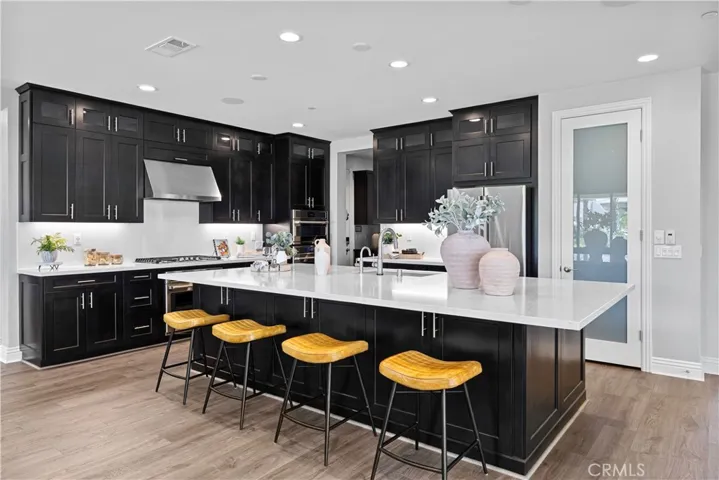 Kona cabinetry with upgraded wrap around and glass uppers