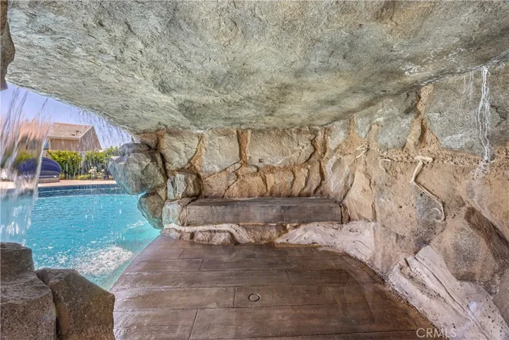  Grotto beneath the waterfall is lighted and wired for TV.