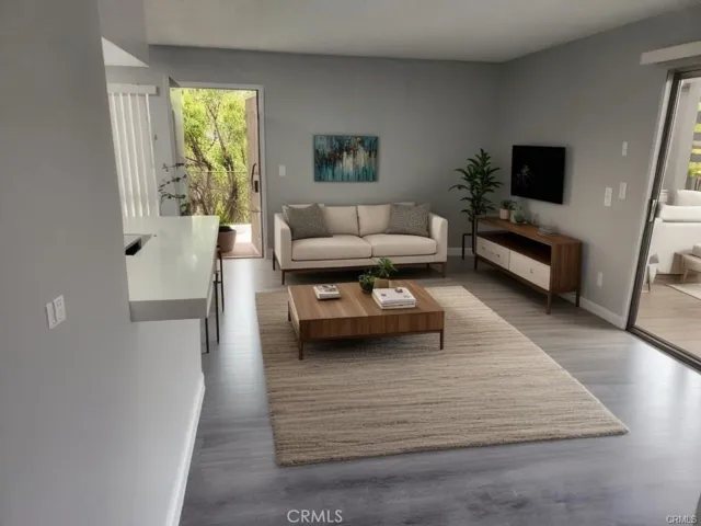 Lots of natural light and high ceilings. Online staged furniture