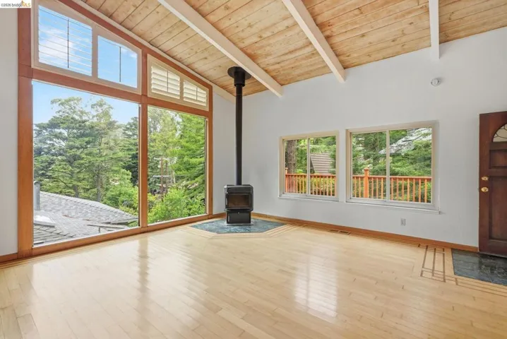 Vaulted wood-paneled ceiling with exposed beams