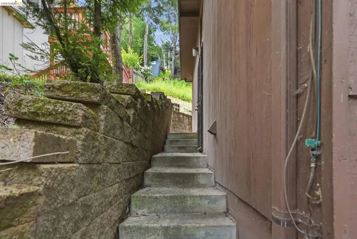 Concrete block retaining wall bordering concrete steps