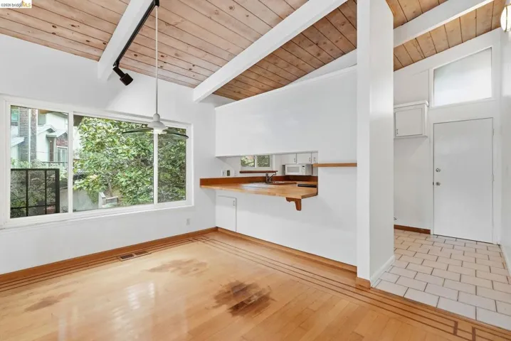 Vaulted wood plank ceiling with exposed beams