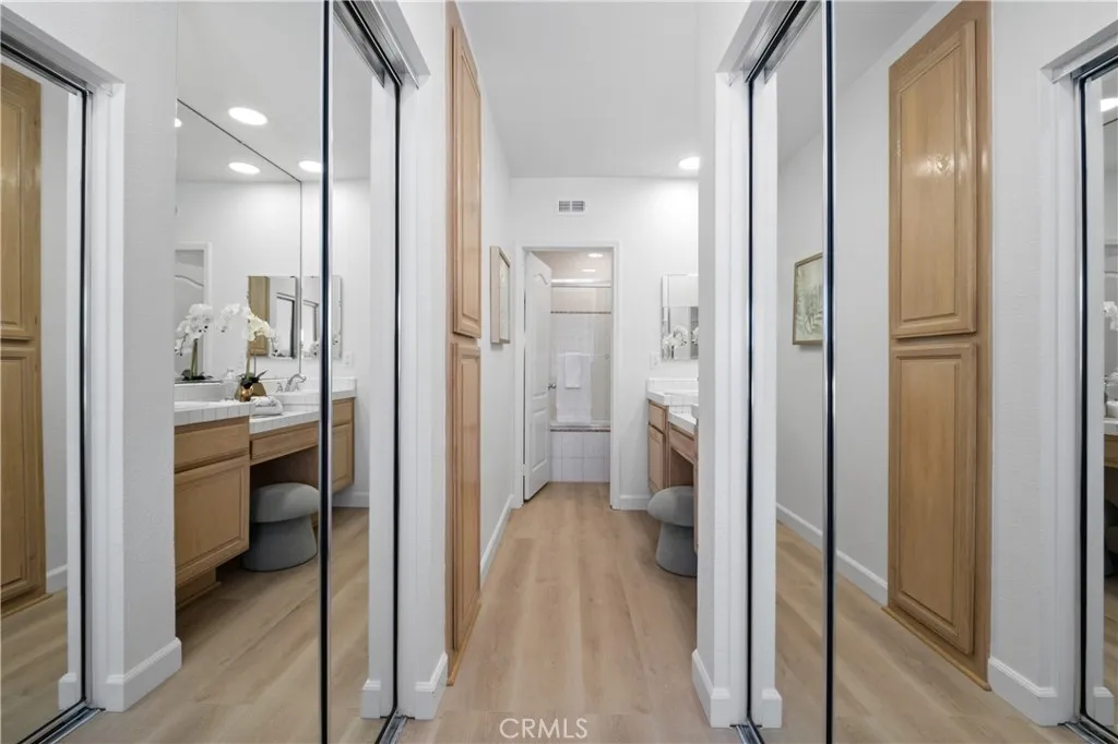 The well-appointed primary suite includes two closets, highlighted by a large walk-in closet that provides abundant storage and organization space.