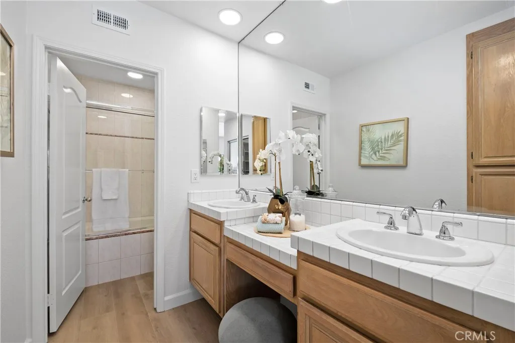 Designed for comfort and functionality, the primary bath offers dual vanities, making busy mornings effortless.