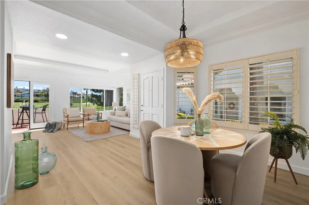 Designed for effortless entertaining, the dining room opens to the spacious living room and extends to the patio, providing a seamless transition between indoor and outdoor living spaces.