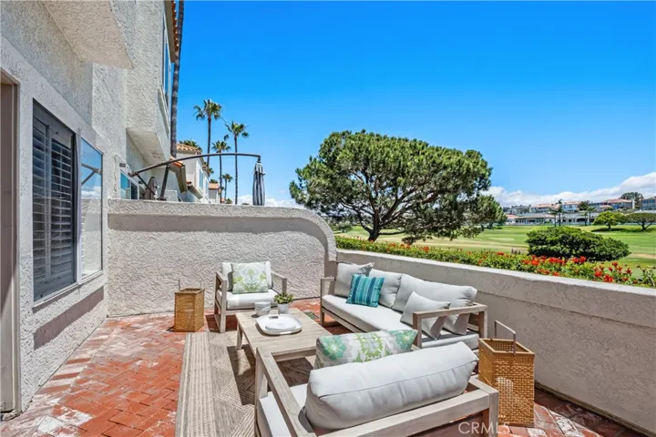 Designed to maximize indoor-outdoor living, the spacious private patio is accessible through elegant French doors from both the living room and primary bedroom, offering a tranquil setting for entertaining or simply enjoying the view.