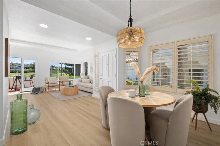 Designed for effortless entertaining, the dining room opens to the spacious living room and extends to the patio, providing a seamless transition between indoor and outdoor living spaces.