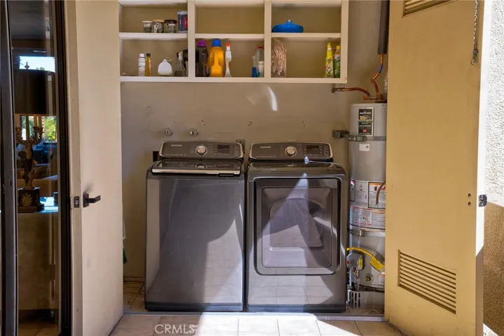 Laundry Closet off of Kitchen Area on side Balcony.