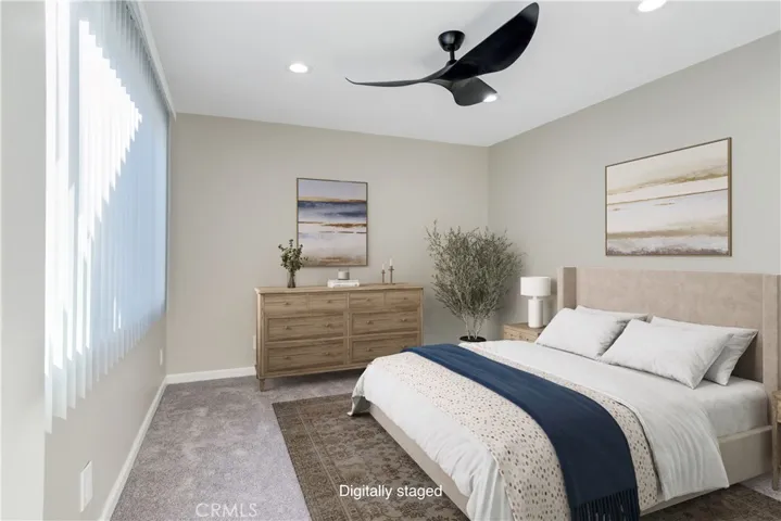 Secondary bedroom that looks out to enclosed patio.