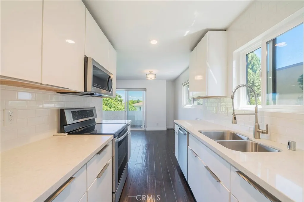 Kitchen view to dining and balcony