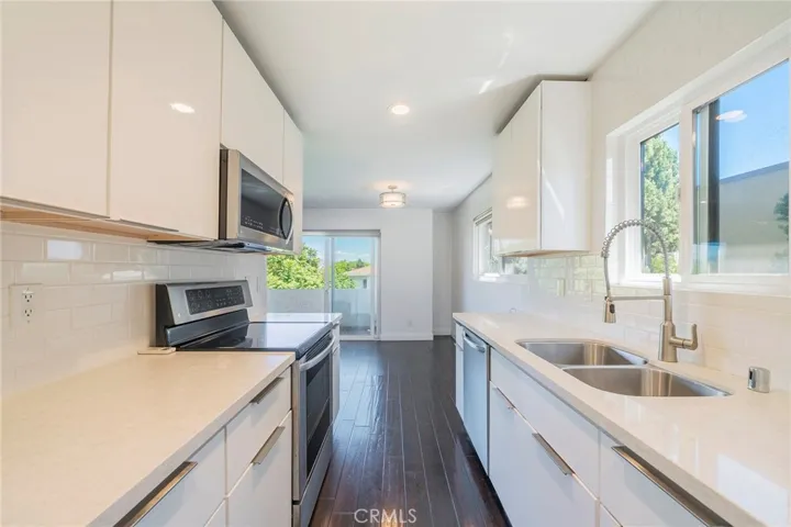 Kitchen view to dining and balcony