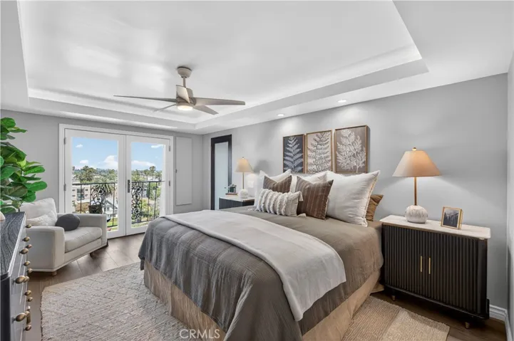 Tranquil, primary retreat offers city views.