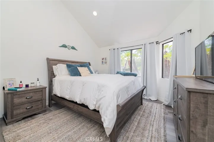 Primary bedroom with high ceiling