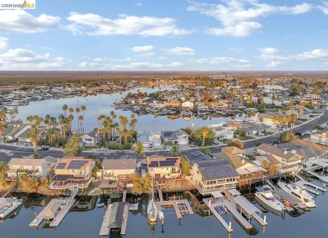 Aerial view of residential area with a large body of water