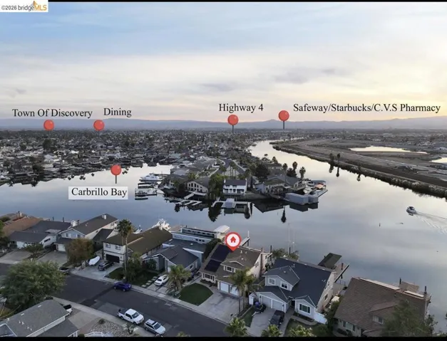 Aerial view of residential area featuring a water and mountain view