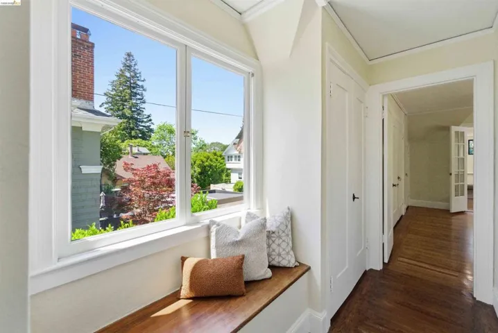 Hallway featuring a built-in window bench with wood-finish top
