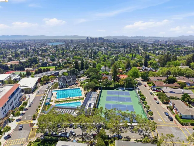 Aerial perspective showcasing an expansive urban landscape with distant mountains