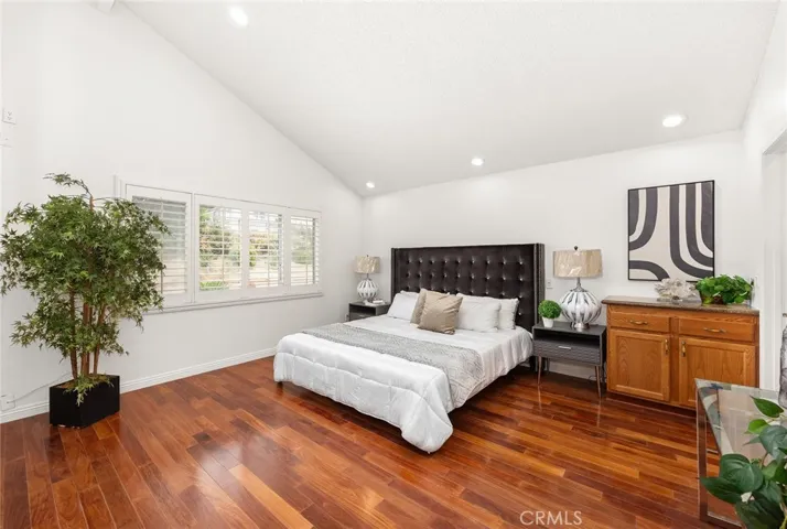 Spacious primary suite with vaulted ceilings