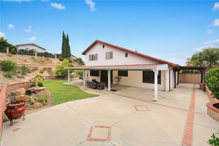 Another backyard view with covered side yard