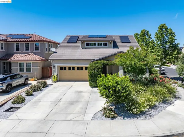 Front exterior with a concrete driveway and an attached two-car garage