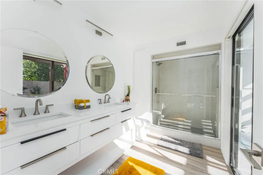 Primary bathroom has sliding door where you can enter wet from a swim in the pool.