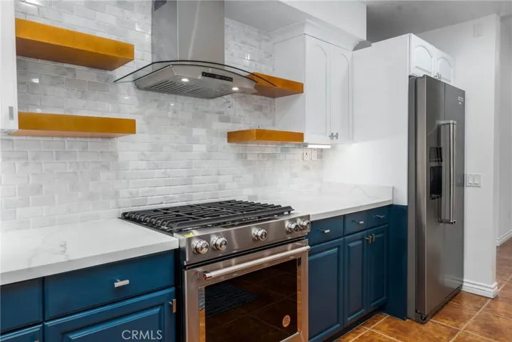 Newer refrigerator and stove that stay. Approx $6,000 invested on appliances.